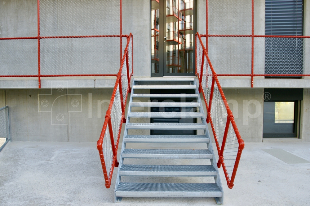 Walkway guardrails constructed with Interclamp tube clamp fittings at a student accommodation block in Switzerland, offering safe passage for students.